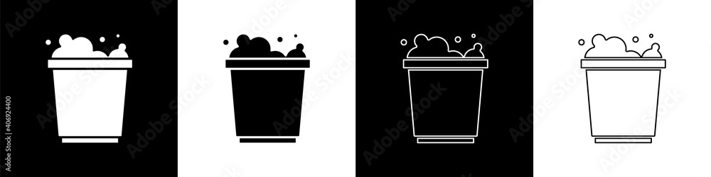 Set Bucket with foam and bubbles icon isolated on black and white background. Cleaning service conce