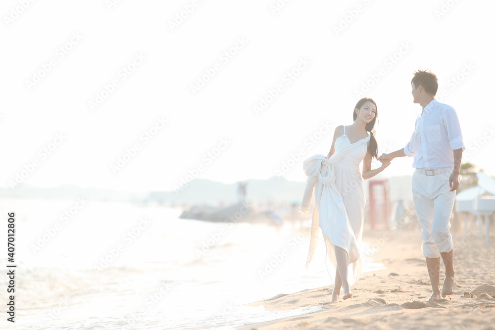 Young Couple in Wedding Dress on beach