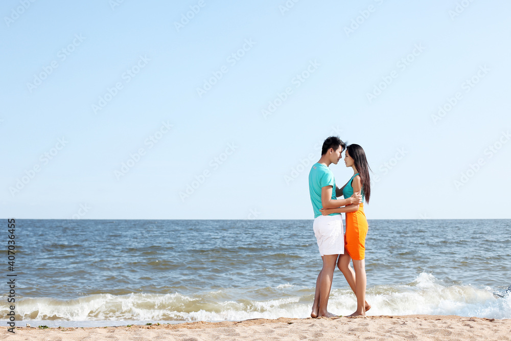 Portrait of young Couple standing on seaside