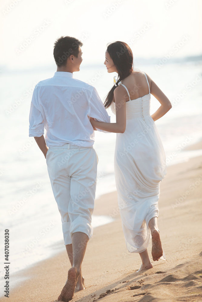 Young Couple in Wedding Dress on beach