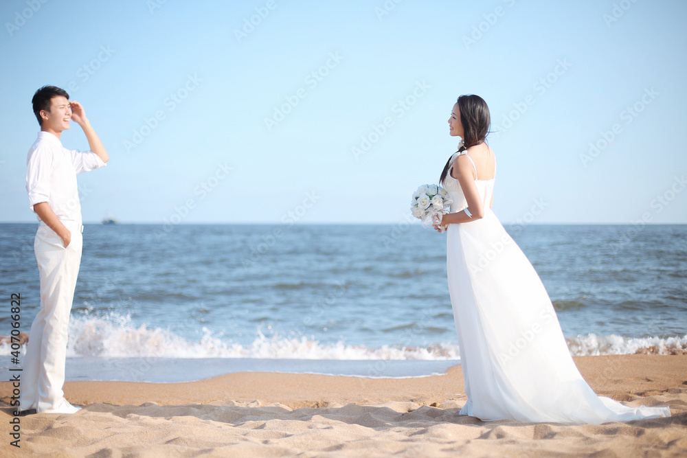 Young Couple in Wedding Dress on beach