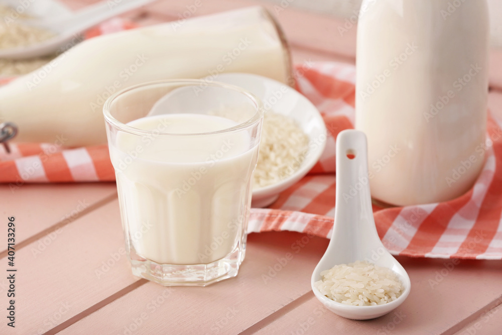 Glass of rice milk on table