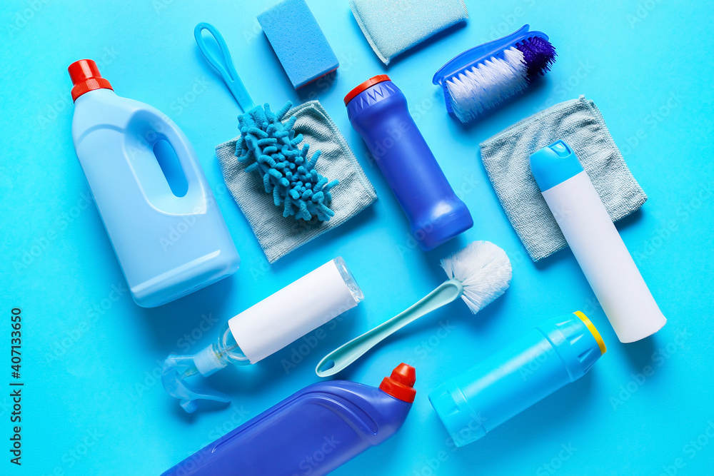 Set of cleaning supplies on color background