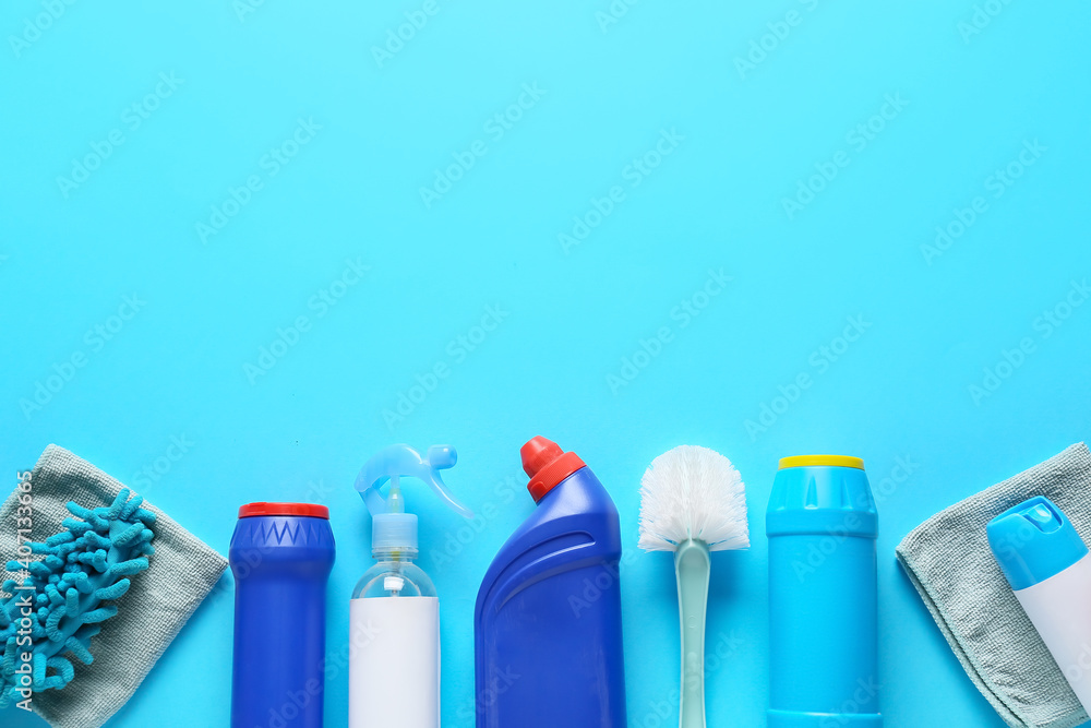 Set of cleaning supplies on color background