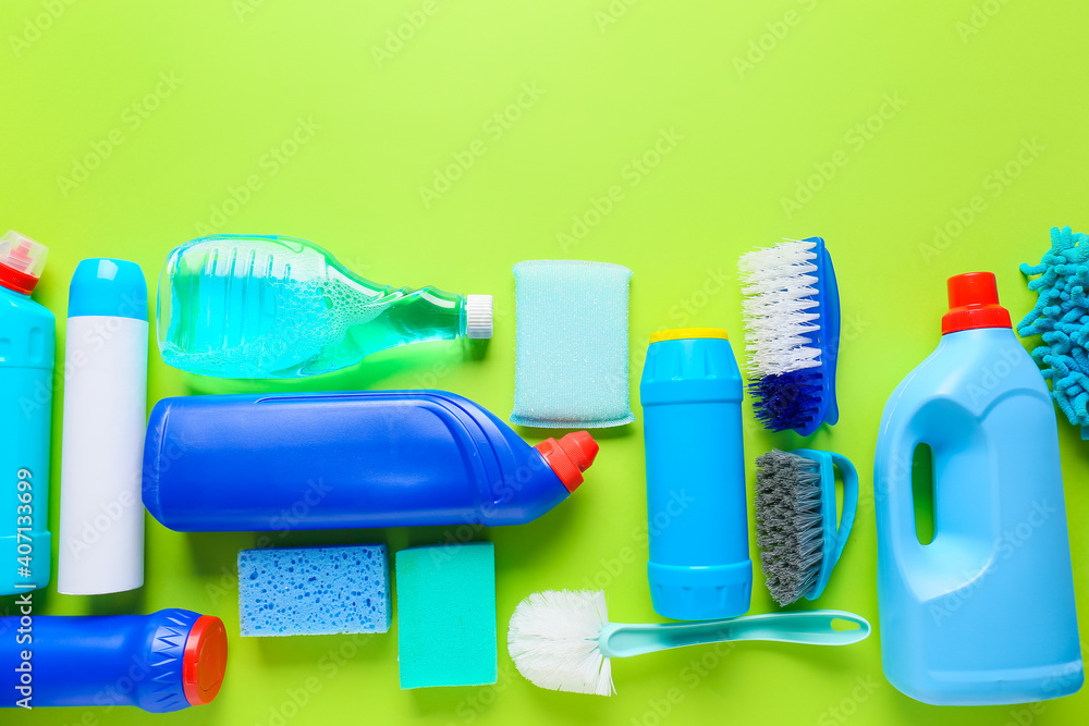 Set of cleaning supplies on color background