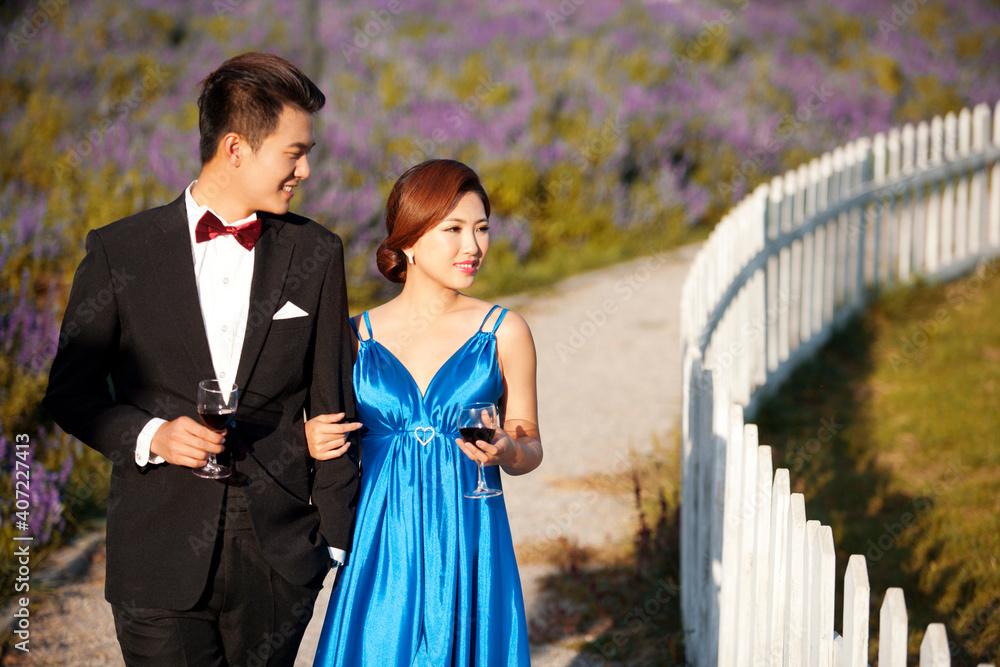 Wearing evening dress fashion of young man and woman in the private estate