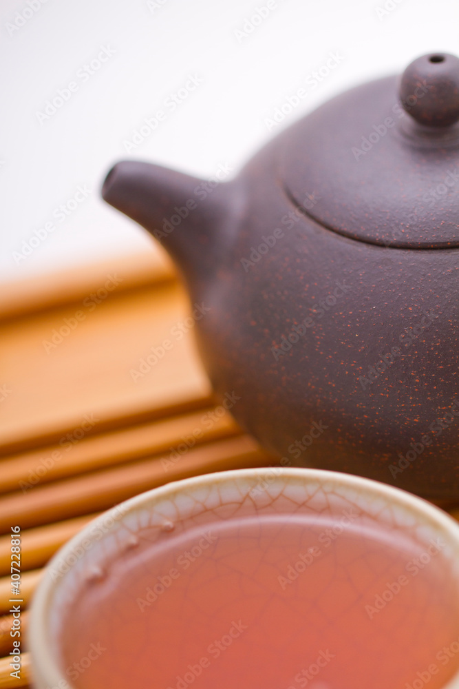 Iron teapot and tea, close-up