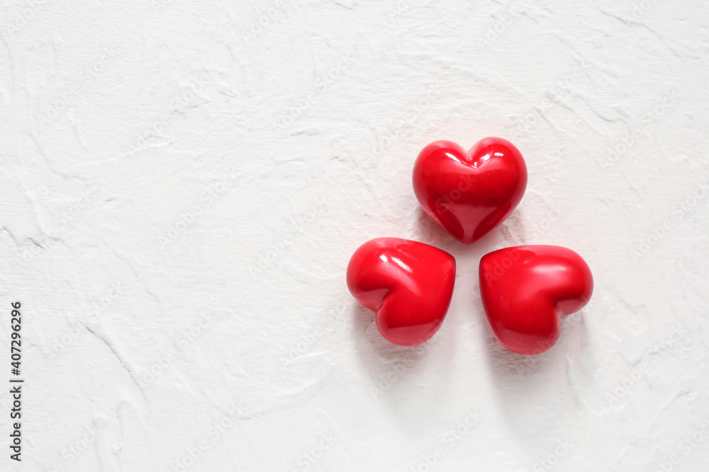 Red hearts on white background