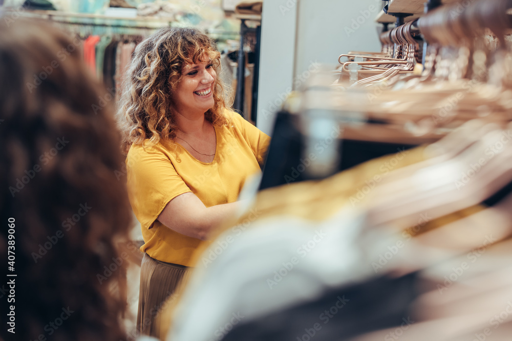 Smiling shopper in fashion store