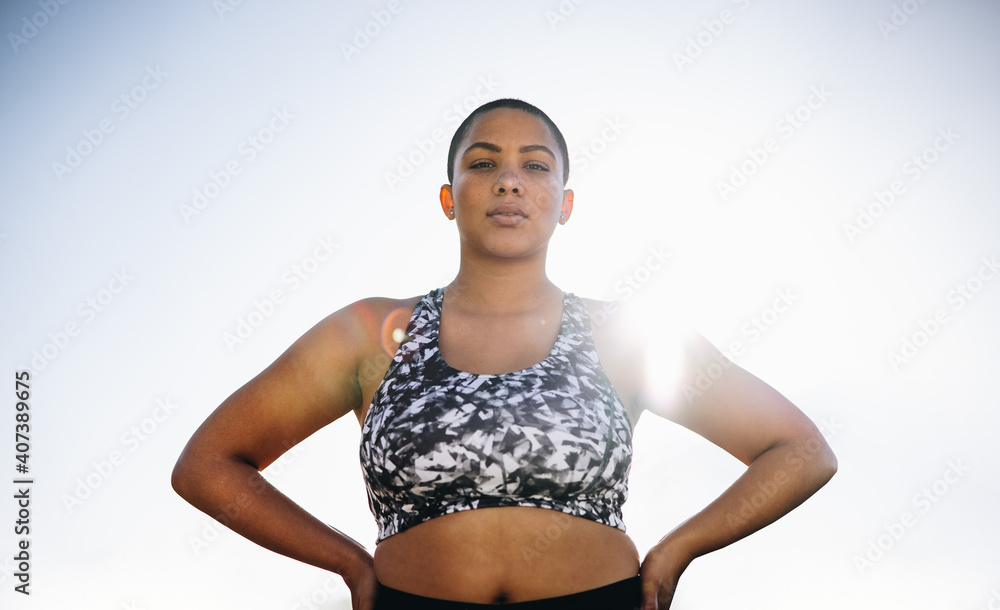 Confident plus size female model in sportswear