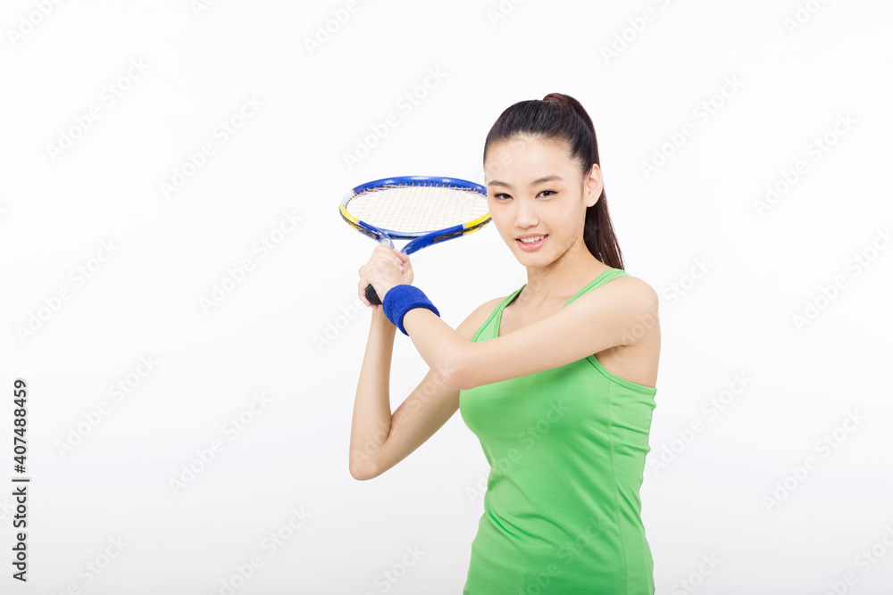 Young woman holding a tennis racket