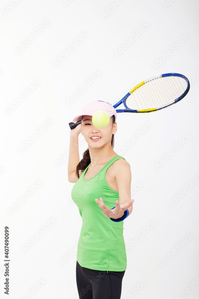 Young woman holding a tennis racket