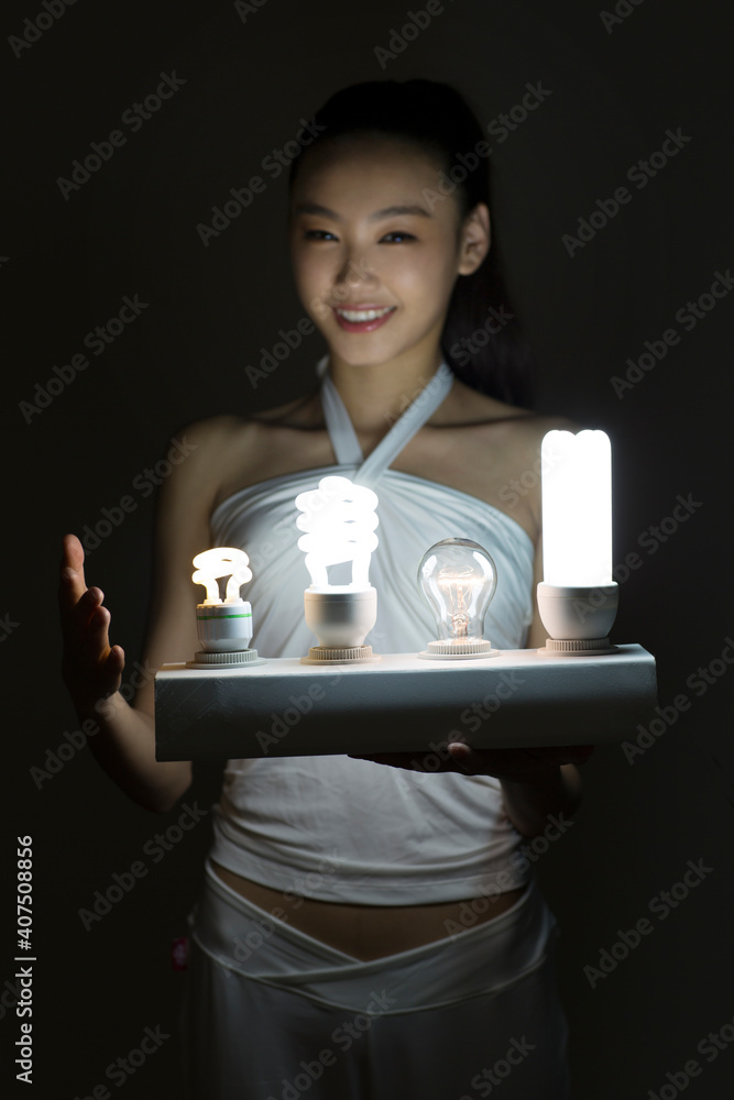 Young woman and a light bulb