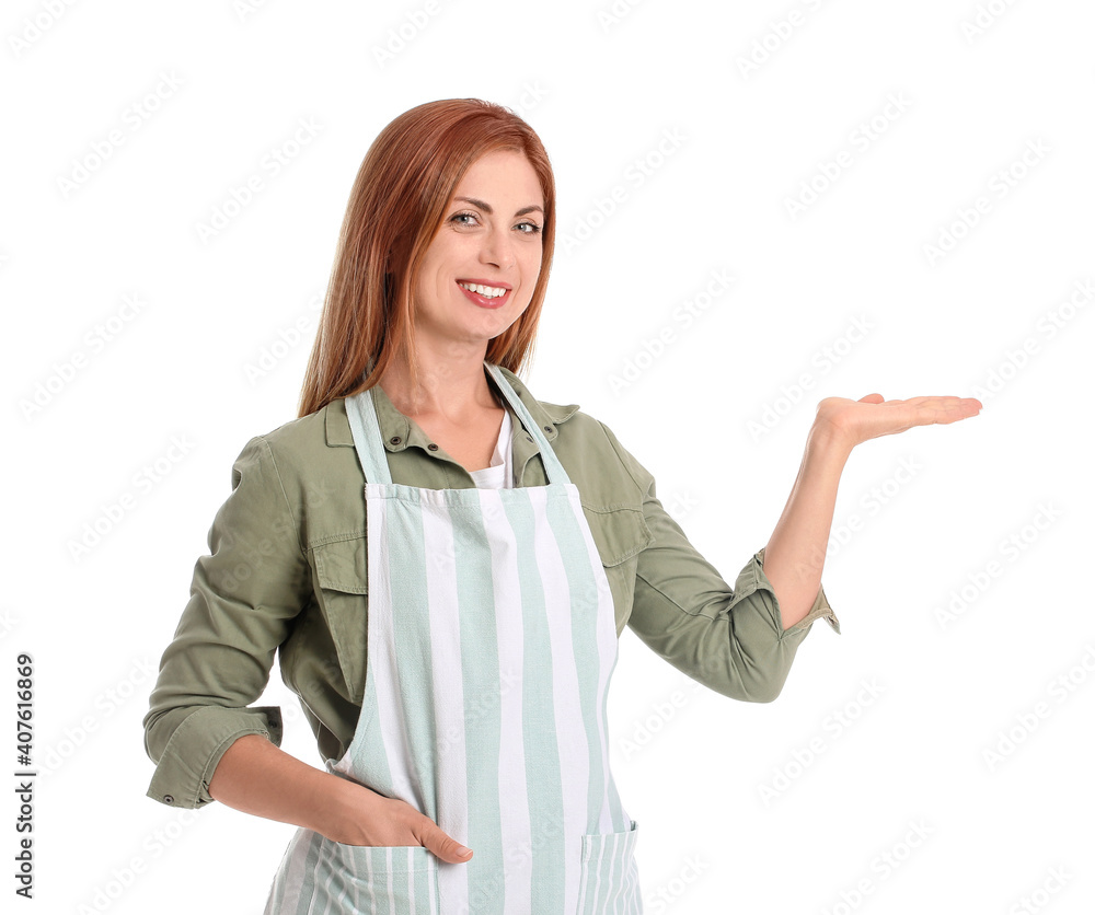 Beautiful young woman showing something on white background