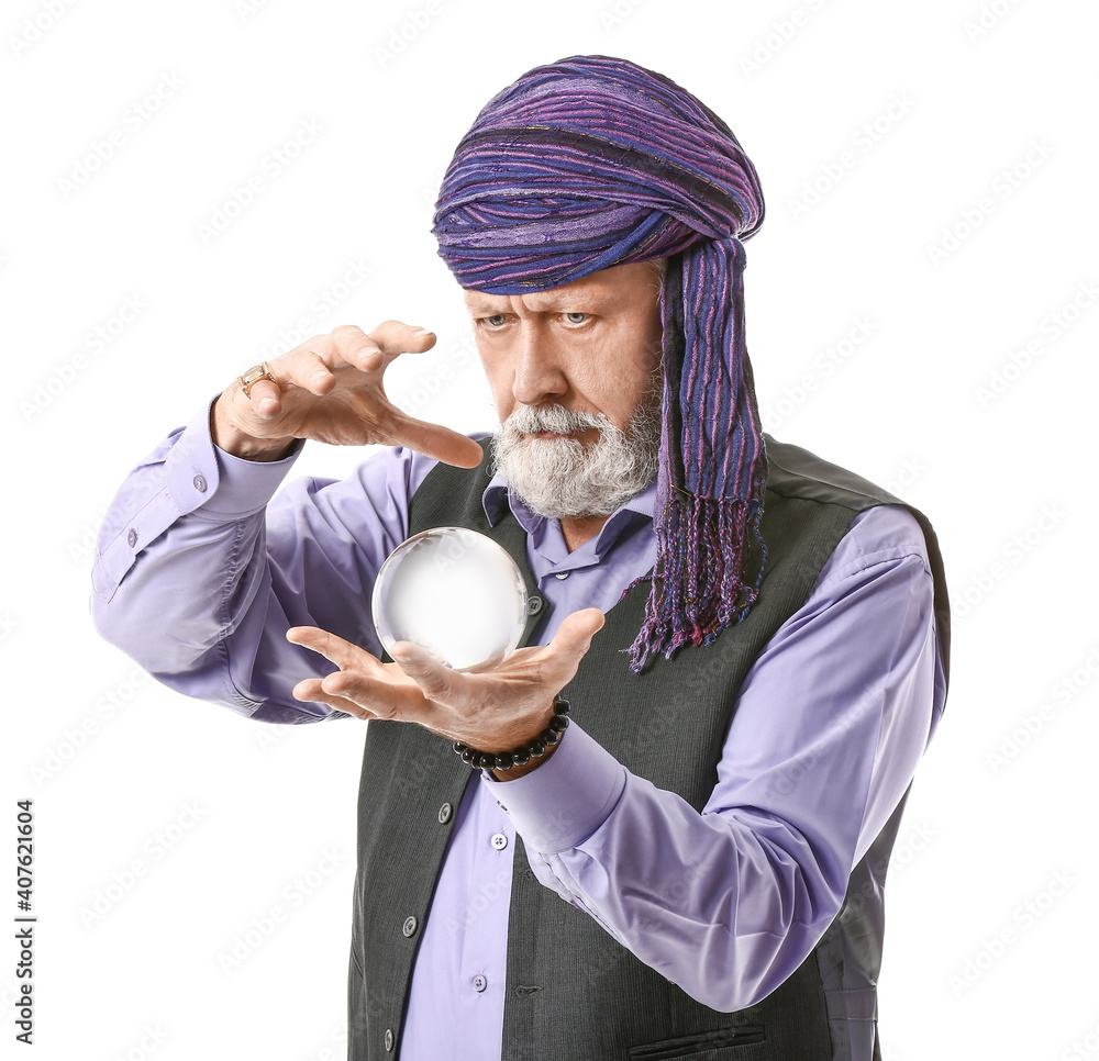 Male fortune teller with crystal ball on white background