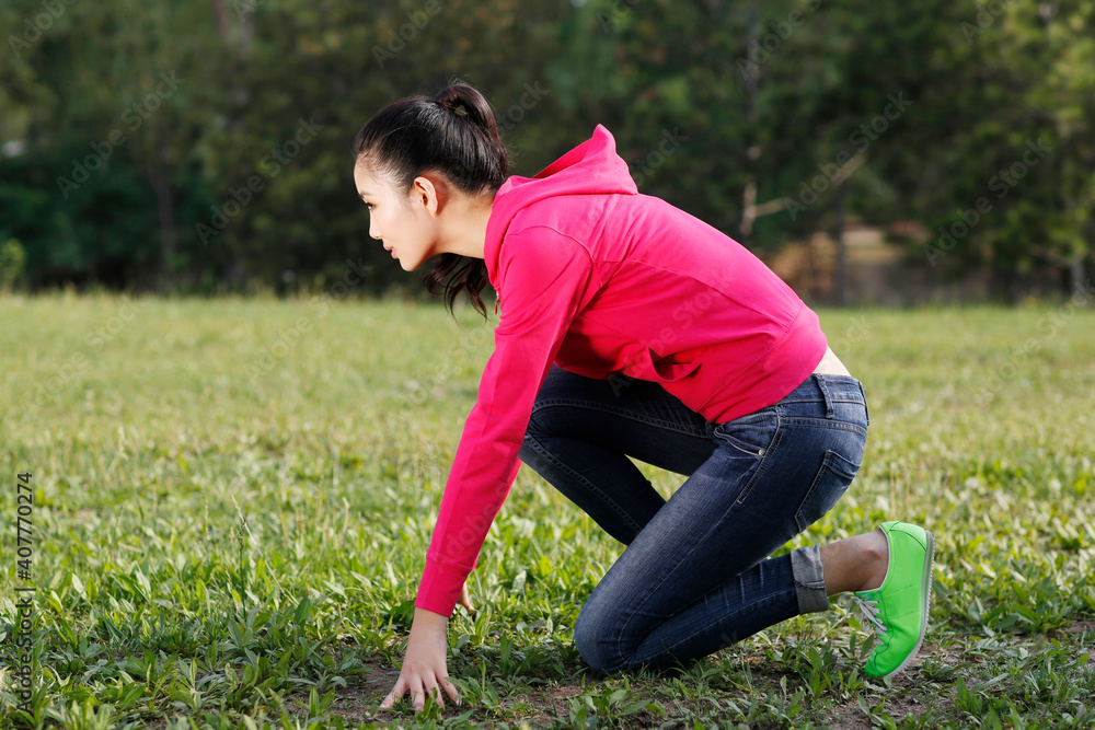 Oriental female youth running in the outdoors