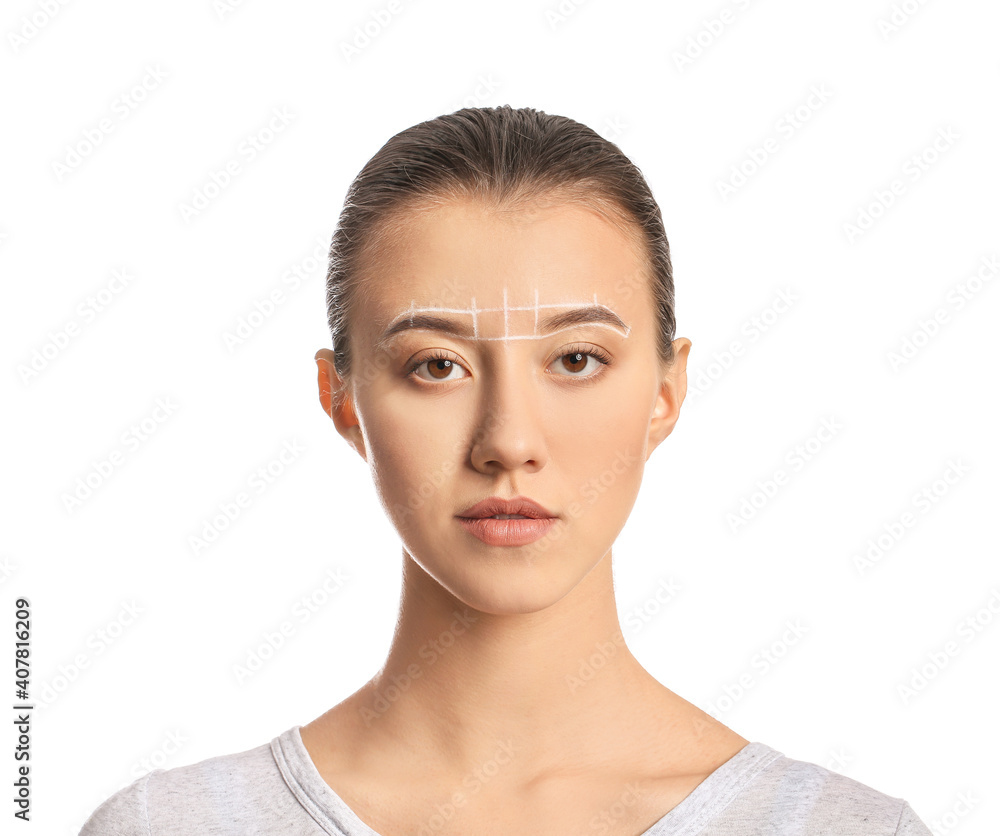 Beautiful young woman with marking for eyebrows correction against white background