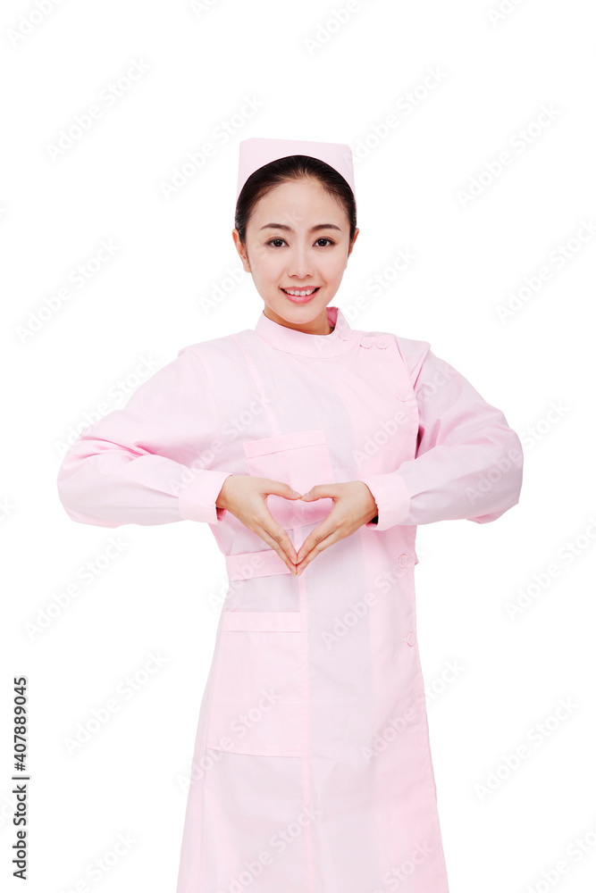 The young female nurses make heart gesture