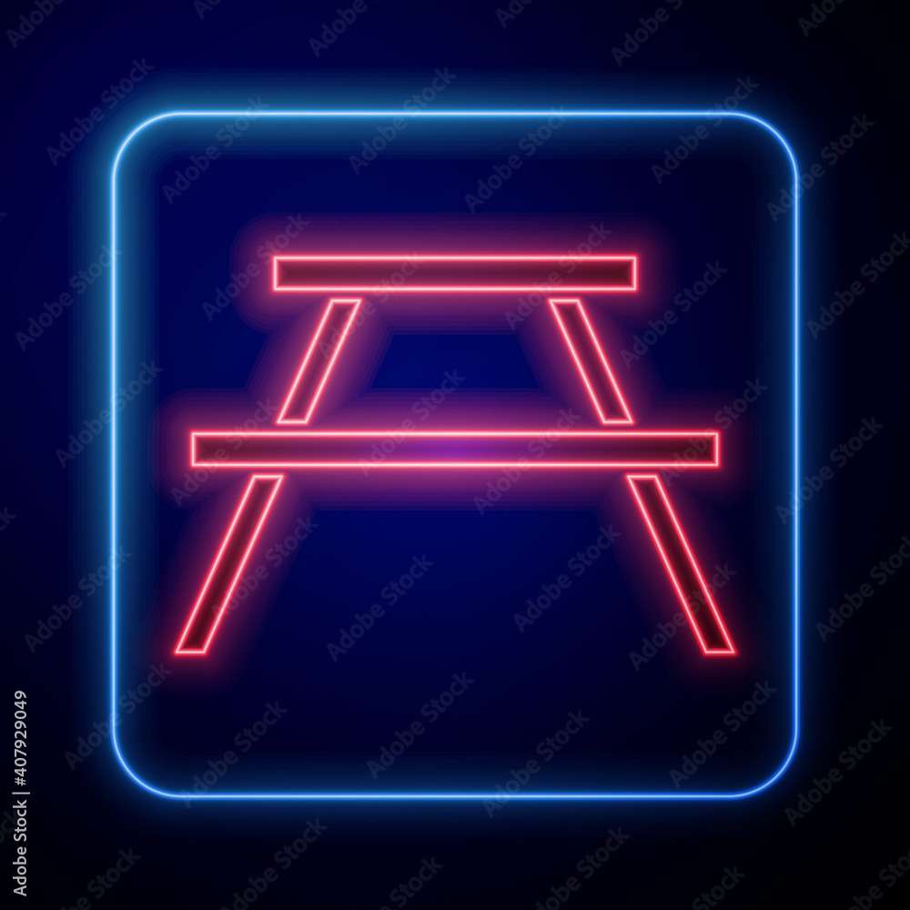 Glowing neon Picnic table with benches on either side of the table icon isolated on blue background.