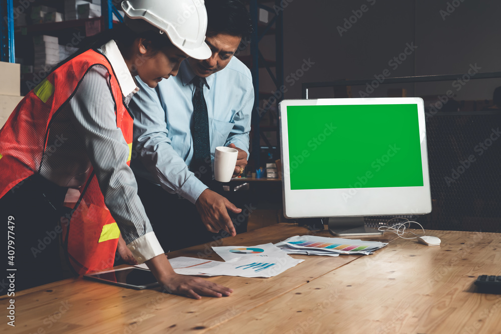 Computer with green screen display in warehouse storage room . Delivery and transportation software 