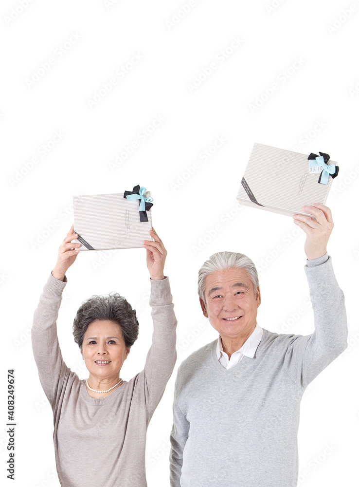 Oriental old couple holding a gift box