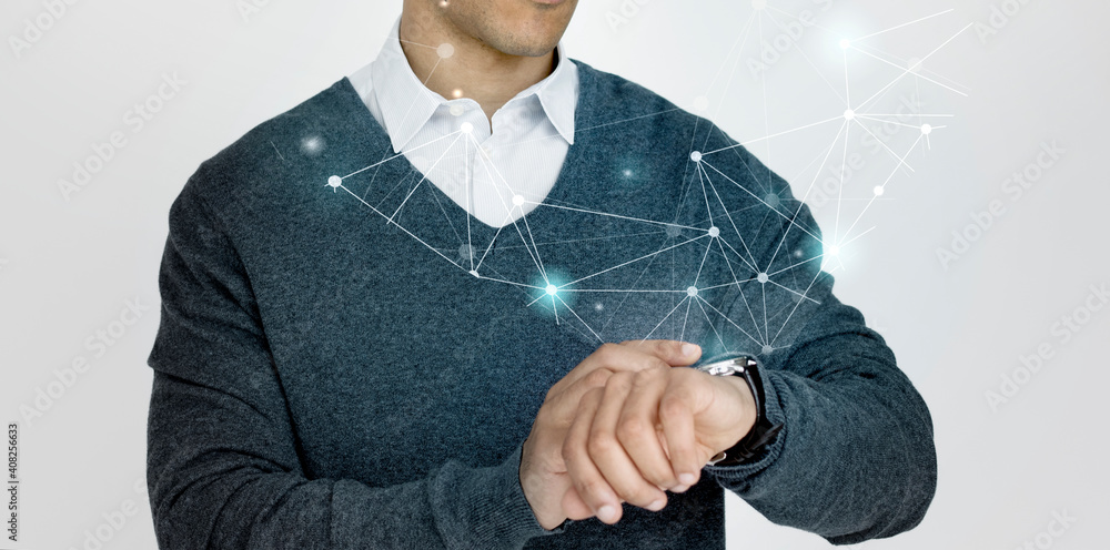 Businessman looking at his futuristic watch