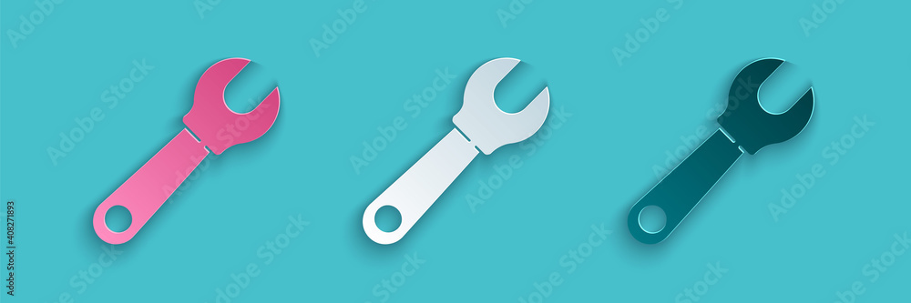 Paper cut Wrench spanner icon isolated on blue background. Paper art style. Vector Illustration.