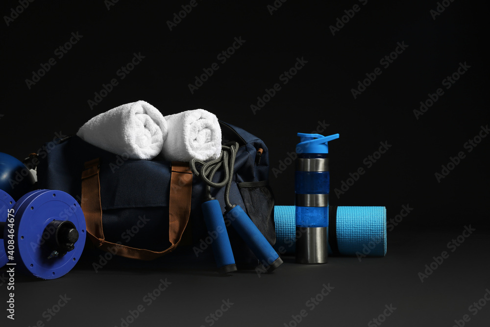 Set of sports equipment on dark background