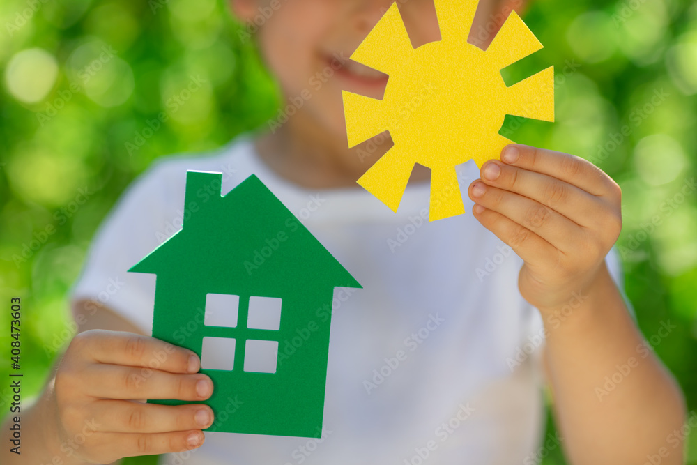 Eco house in children`s hands