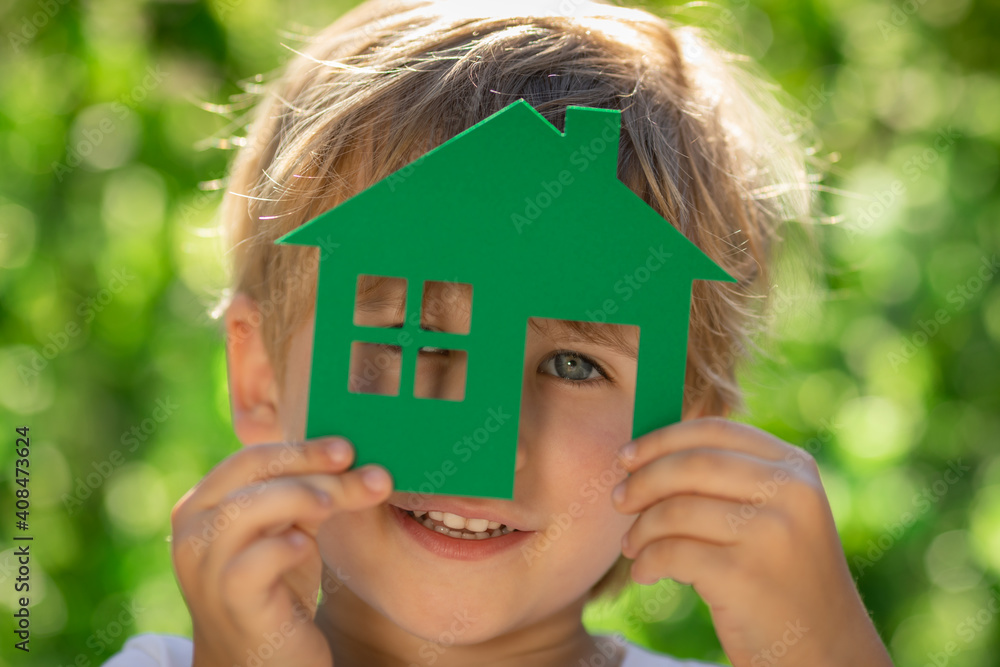 Eco house in children`s hands