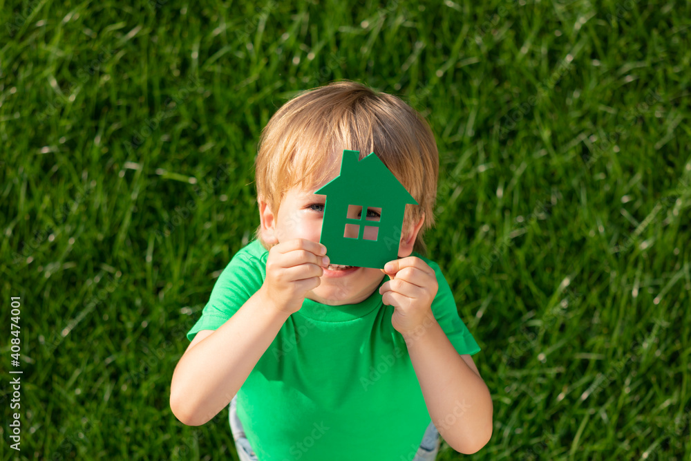 Eco house in children`s hands