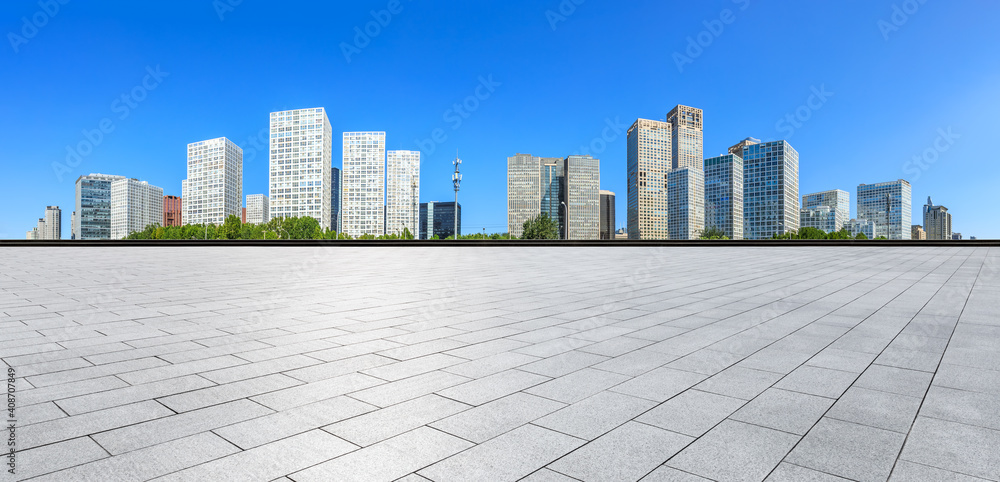 Empty square floor and modern city commercial buildings in Beijing,China.