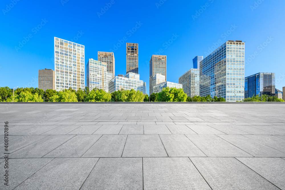 Empty square floor and modern city commercial buildings in Beijing,China.