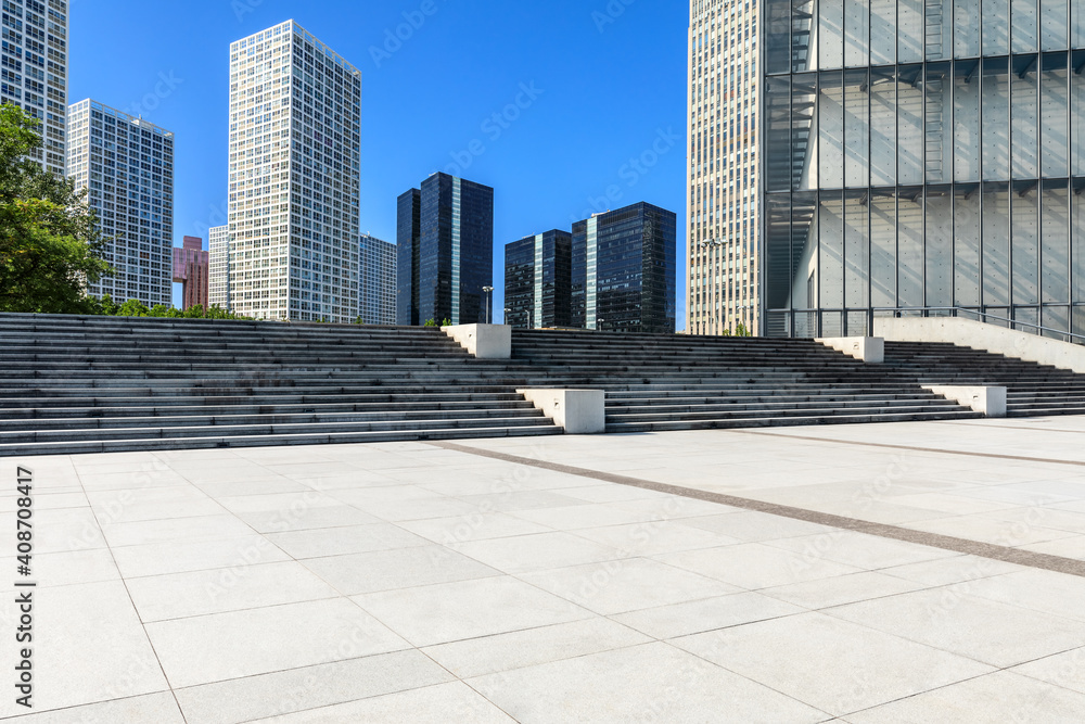 Empty square floor and modern city commercial buildings in Beijing,China.