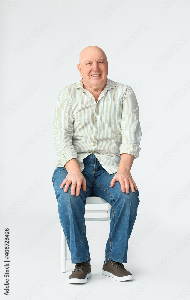 Portrait of senior man on white background