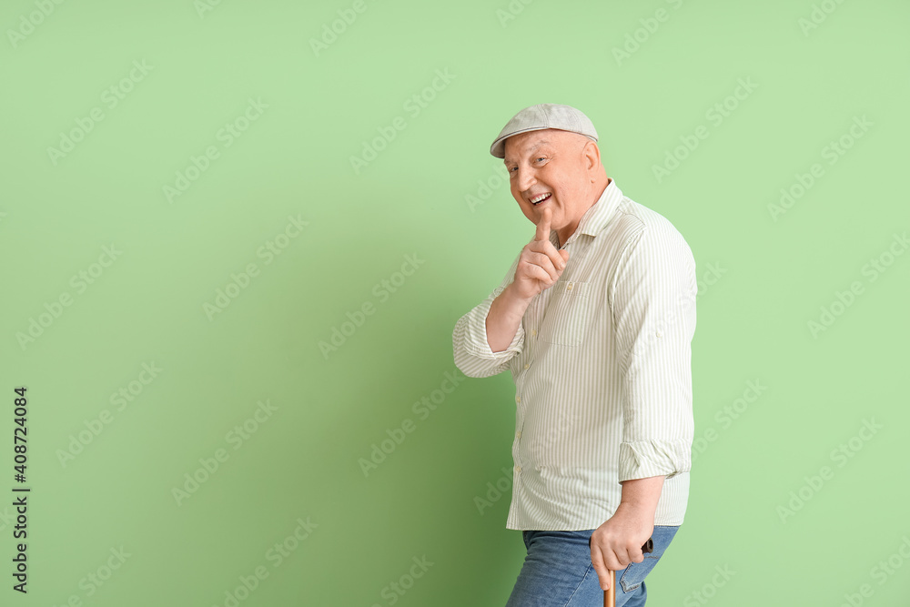 Portrait of senior man on color background