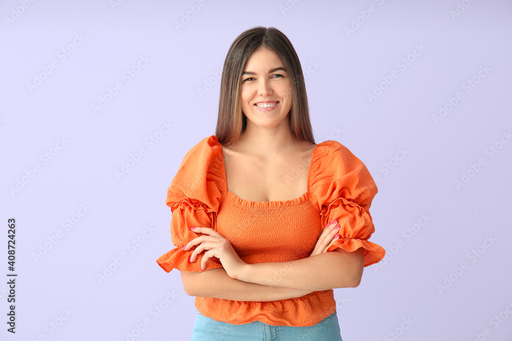 Portrait of beautiful young woman on color background