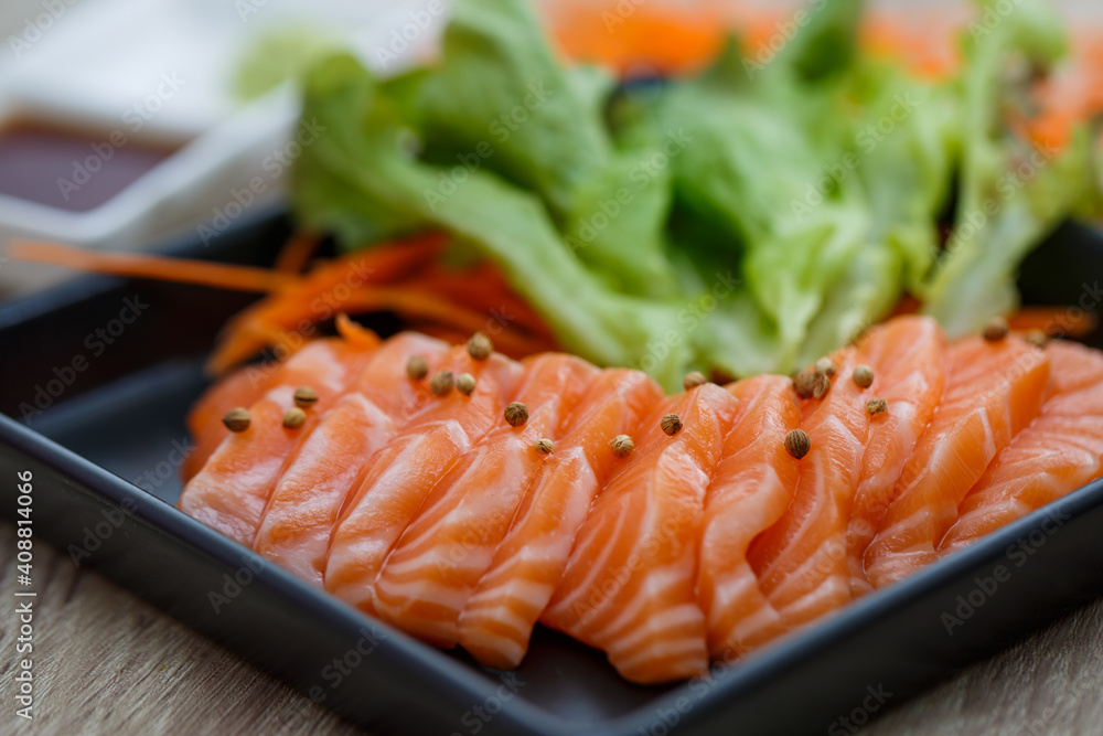 Raw salmon slice or salmon sashimi in Japanese style