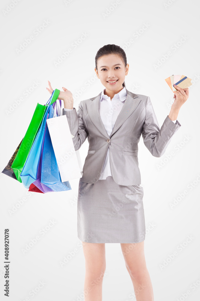 Oriental business woman with credit card shopping