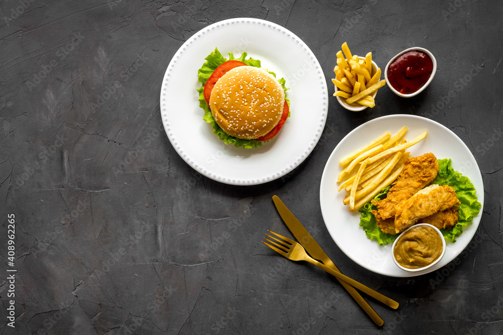 Delicious burgers with french fries and fried chicken. Flat lay, top view