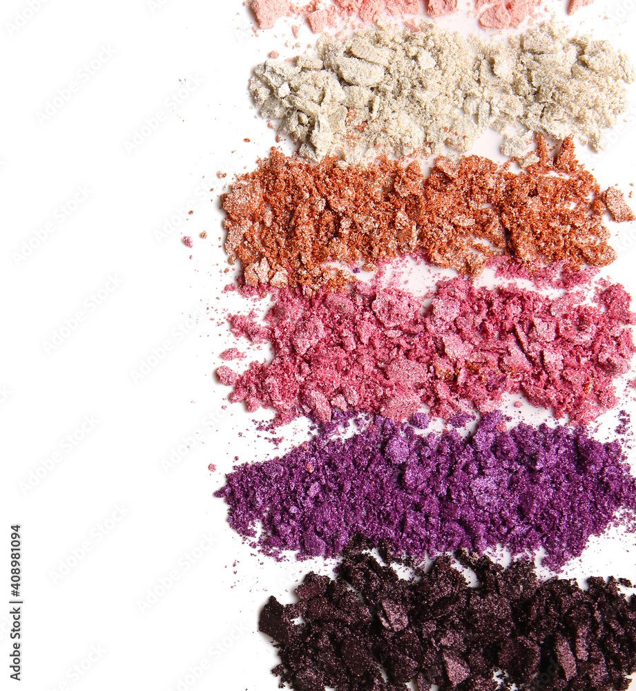 Different crushed eyeshadows on white background