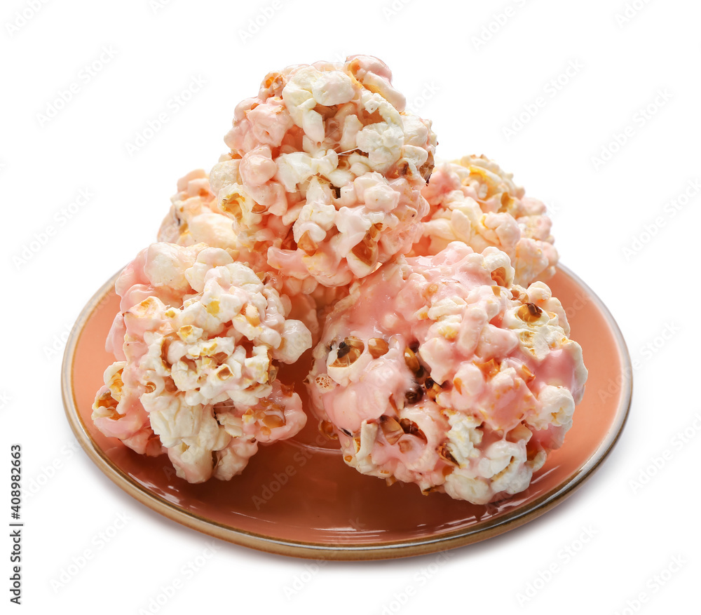 Plate with tasty popcorn balls on white background