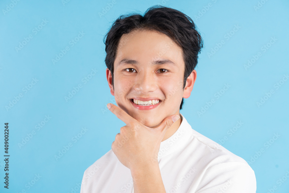 Portrait of young man smiling and looking at camera