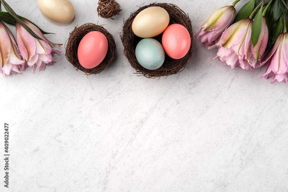 Colorful Easter eggs in the nest with pink Double Lily flower.