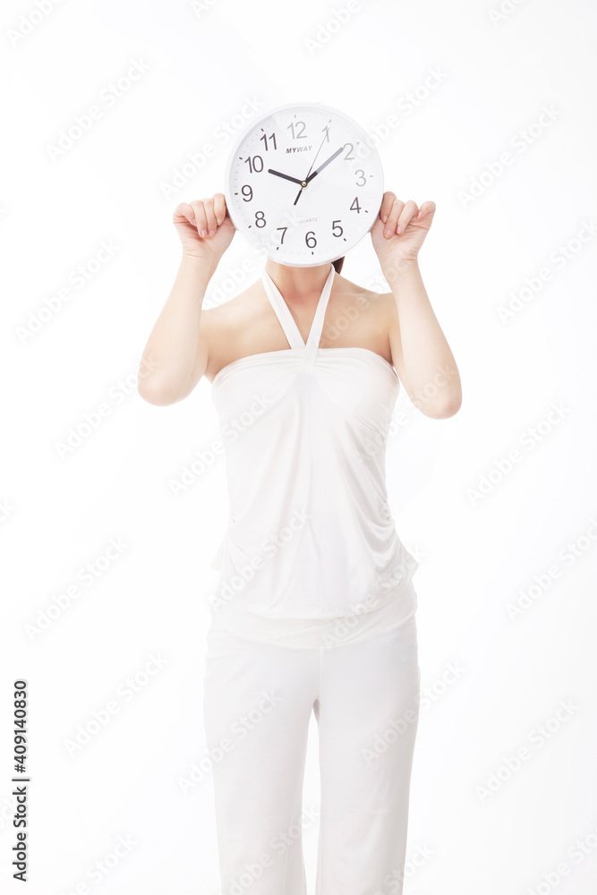 Young fashion woman holding clocks