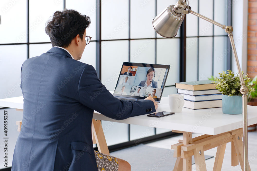 Young Asian funny businessman wearing underwear boxer work at home and virtual video conference meet