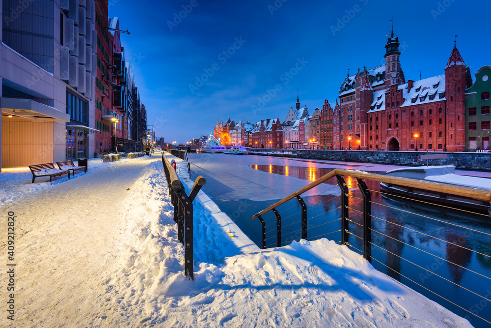 The granaries island over Motlawa river at snowy dawn, Gdansk. Poland