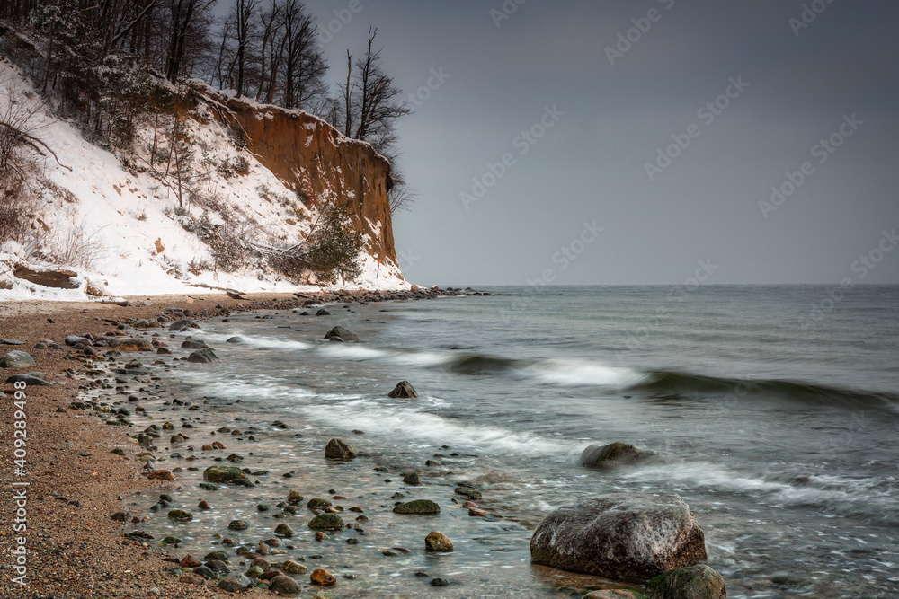 Beautiful landscape of the cliff in Gdynia Orłowo in snowy winter, Baltic Sea. Poland