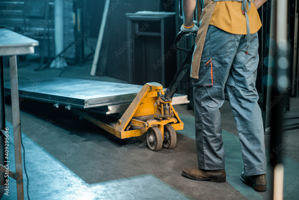 Metal industry worker working at the warehouse