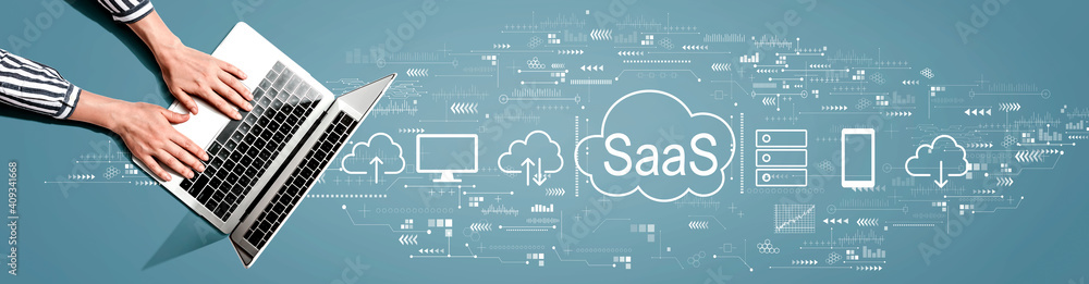 SaaS - software as a service concept with person using a laptop computer